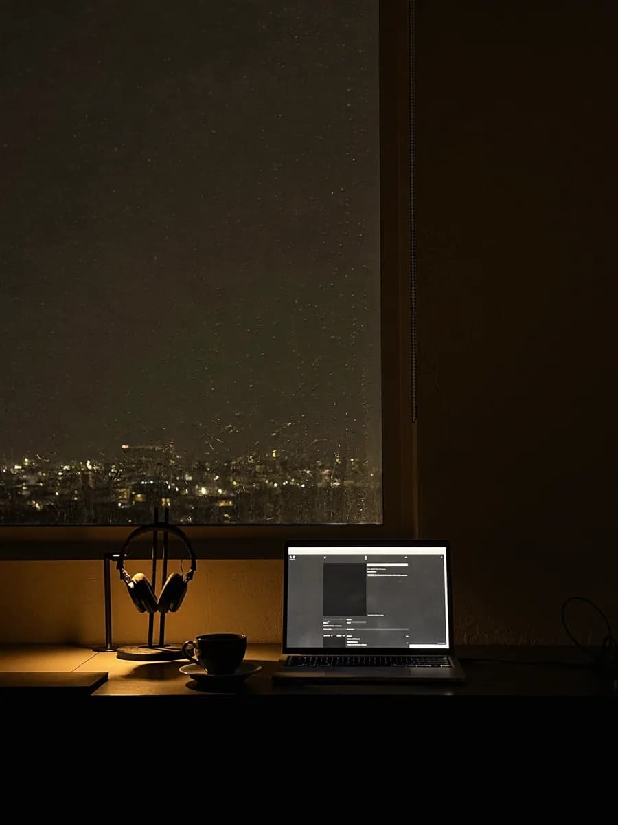 Remote workspace with screens and warm light